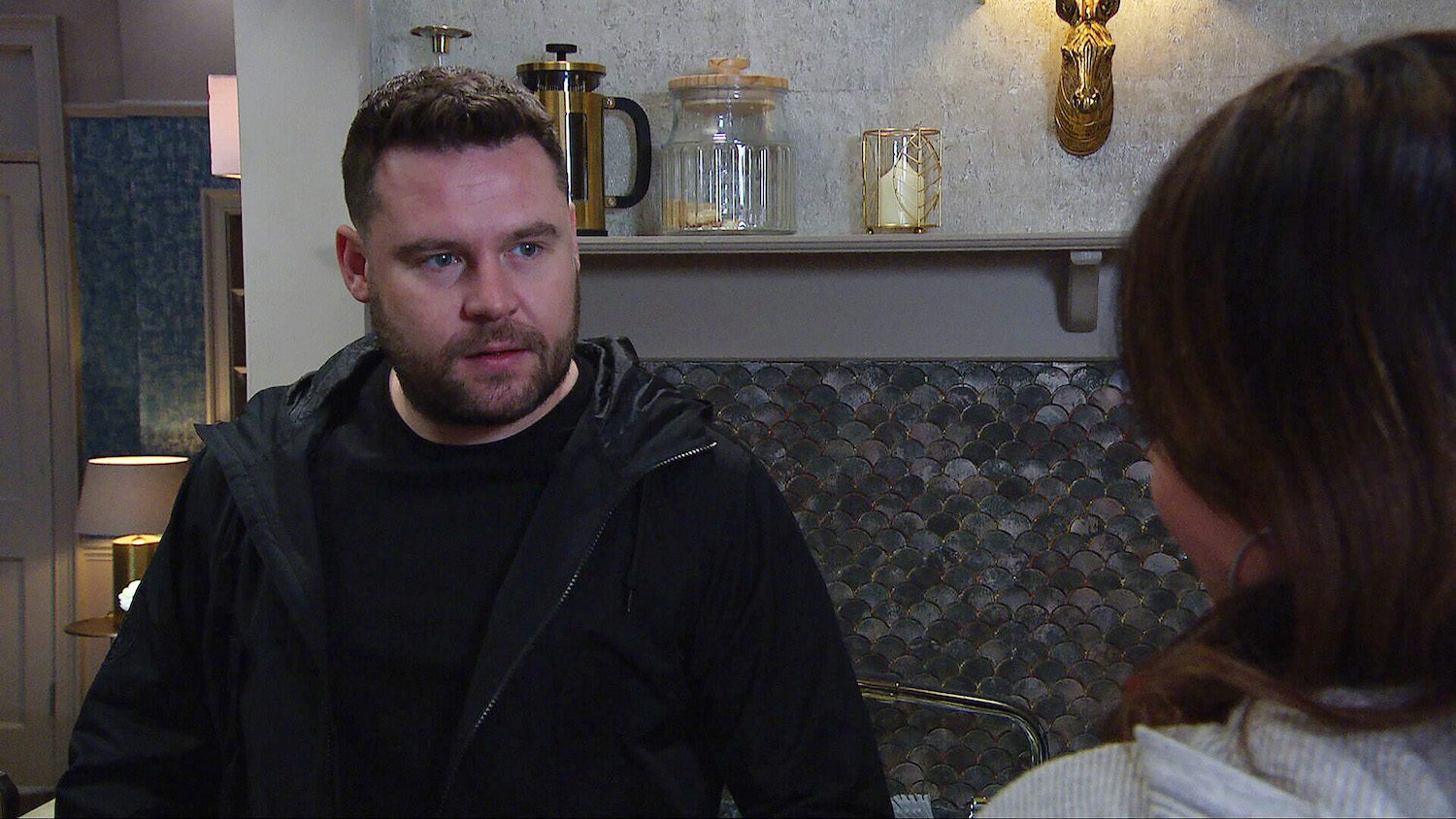 Emmerdale's Aaron is having a serious conversation with Chas in the kitchen