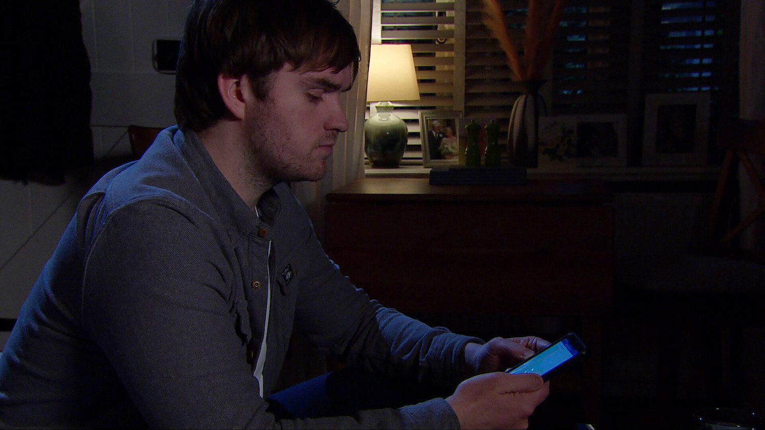 Tom on his phone in Emmerdale