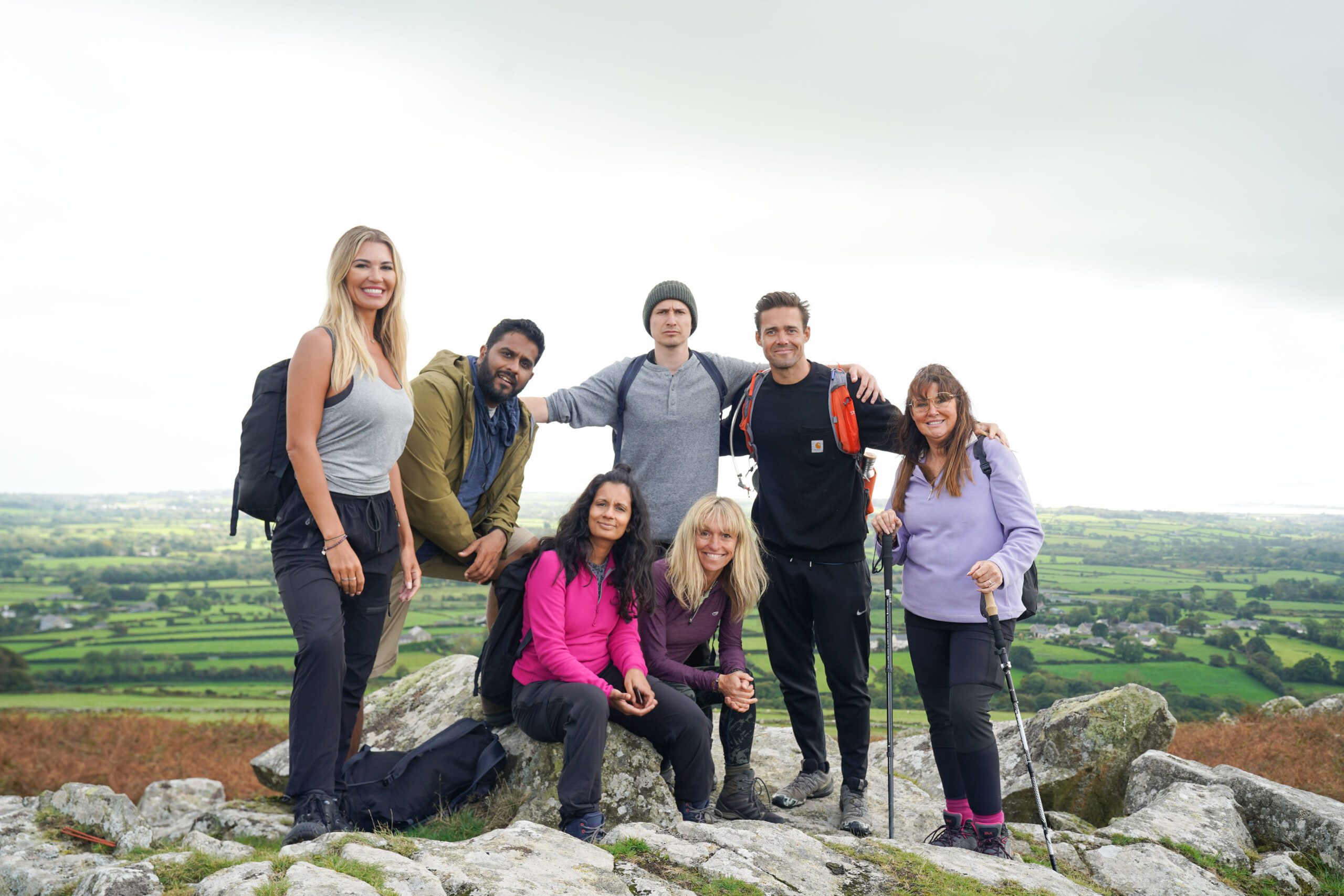 Christine McGuinness and the cast of Pilgrimage atop a hill 