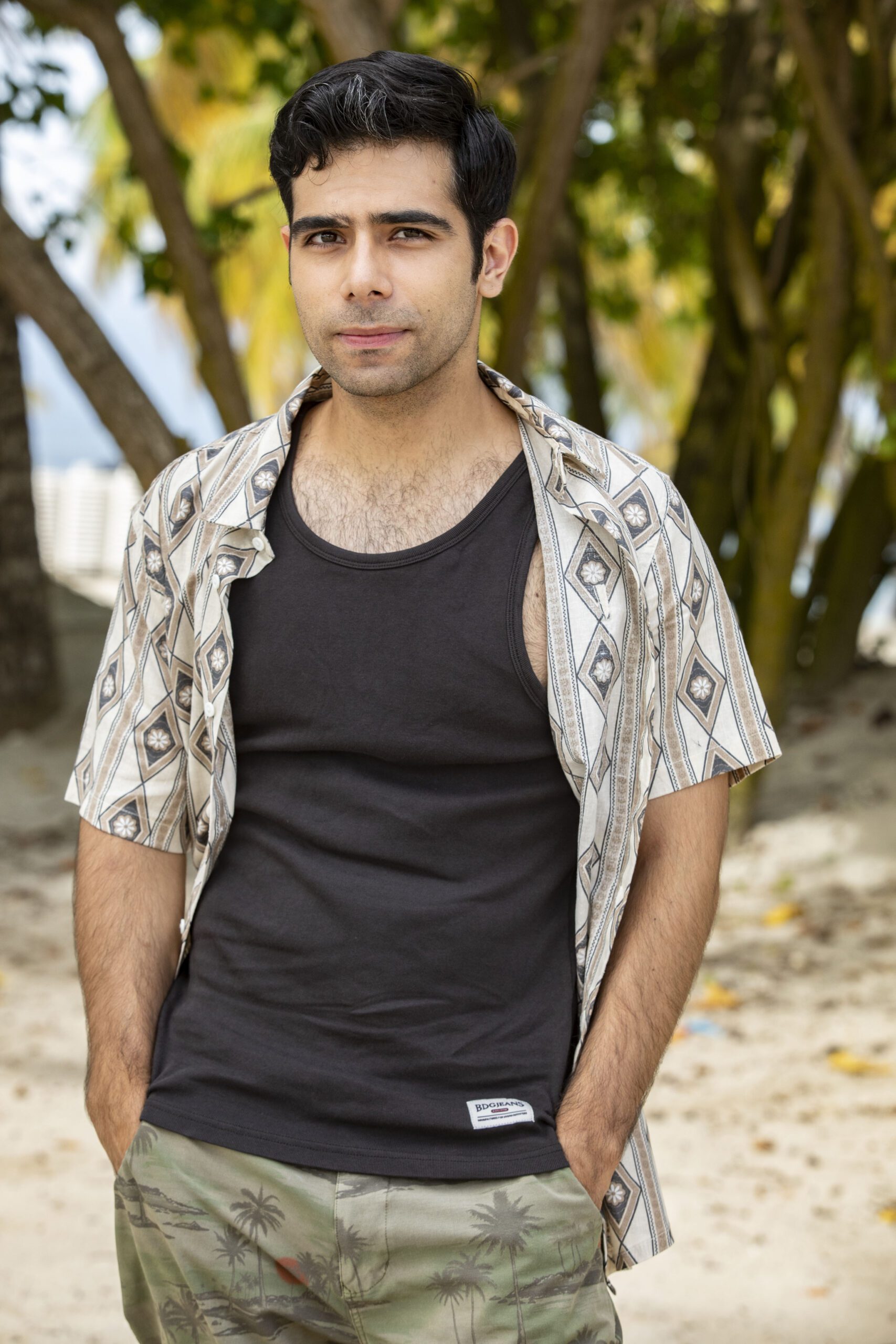 Ali Ariaie portrays Sam Portland in the cast of Death in Paradise series 13 episode 6