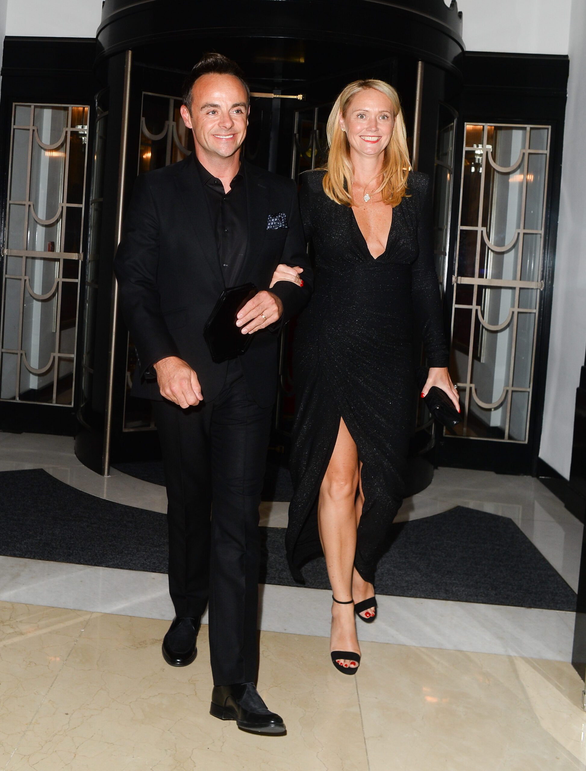Ant McPartlin and Anne-Marie Corbett walking out of a hotel