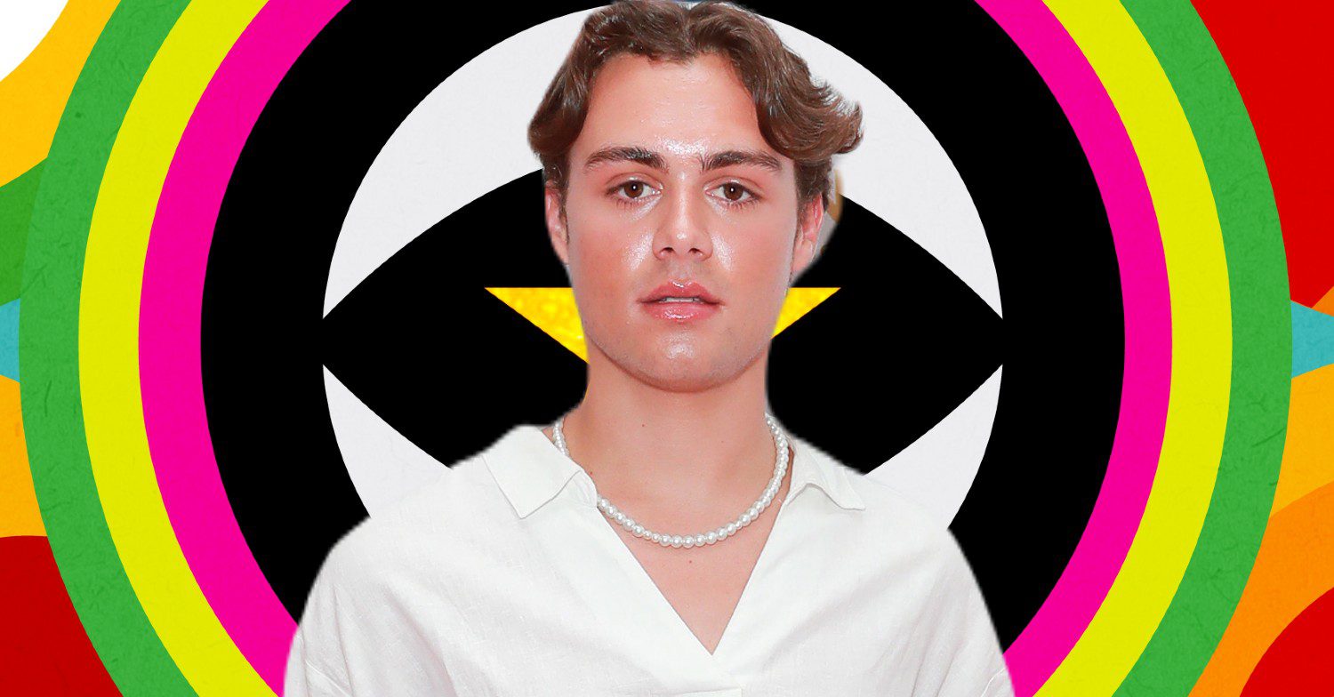 Bradley Riches in front of Celebrity Big Brother logo