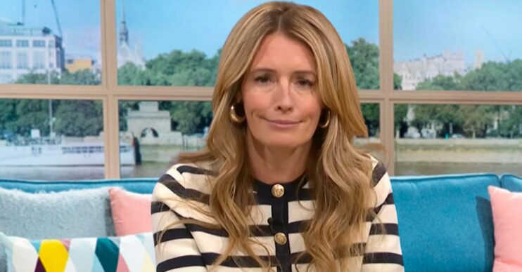 Cat Deeley striped jumper with amused expression whilst presenting This Morning