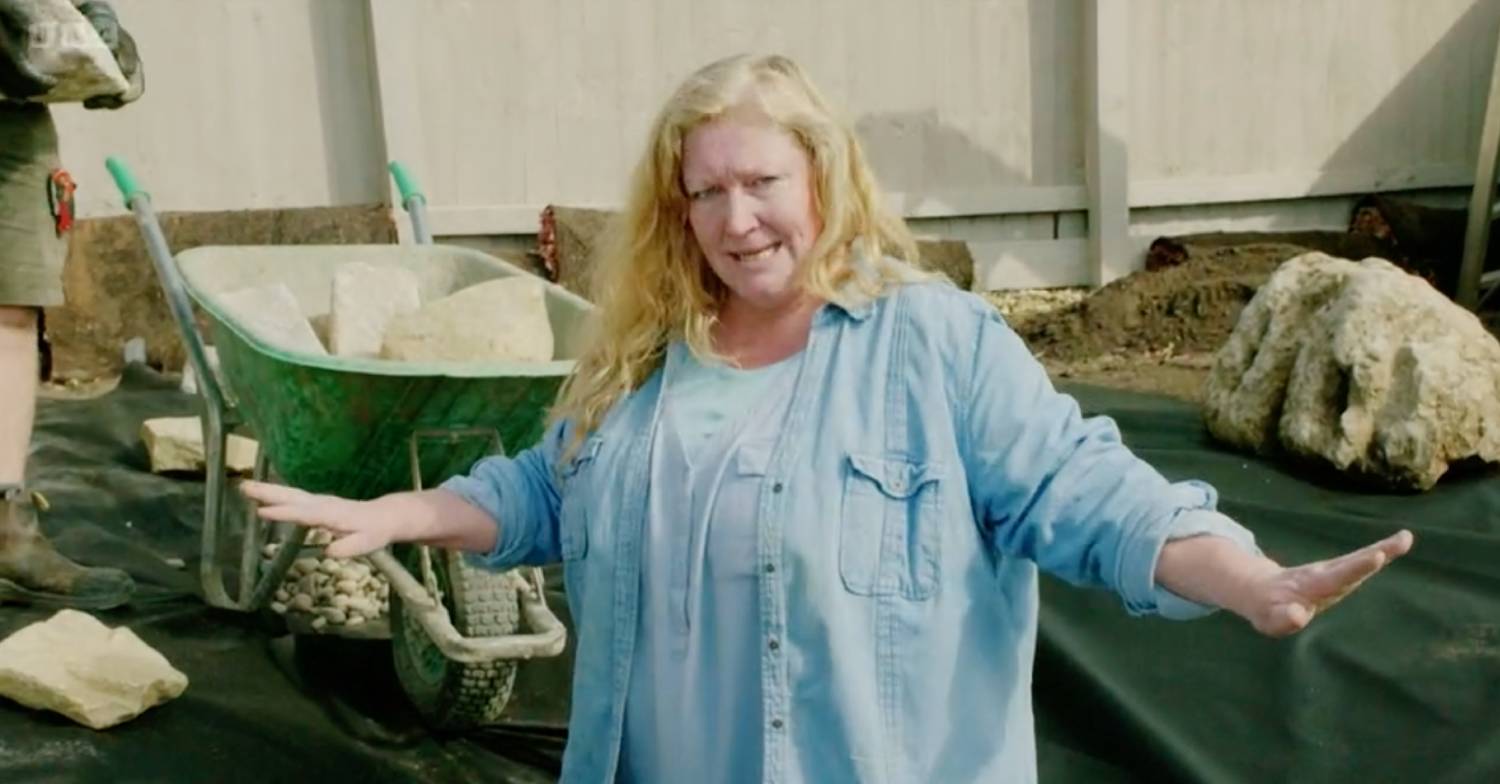 Charlie Dimmock holds out her arms