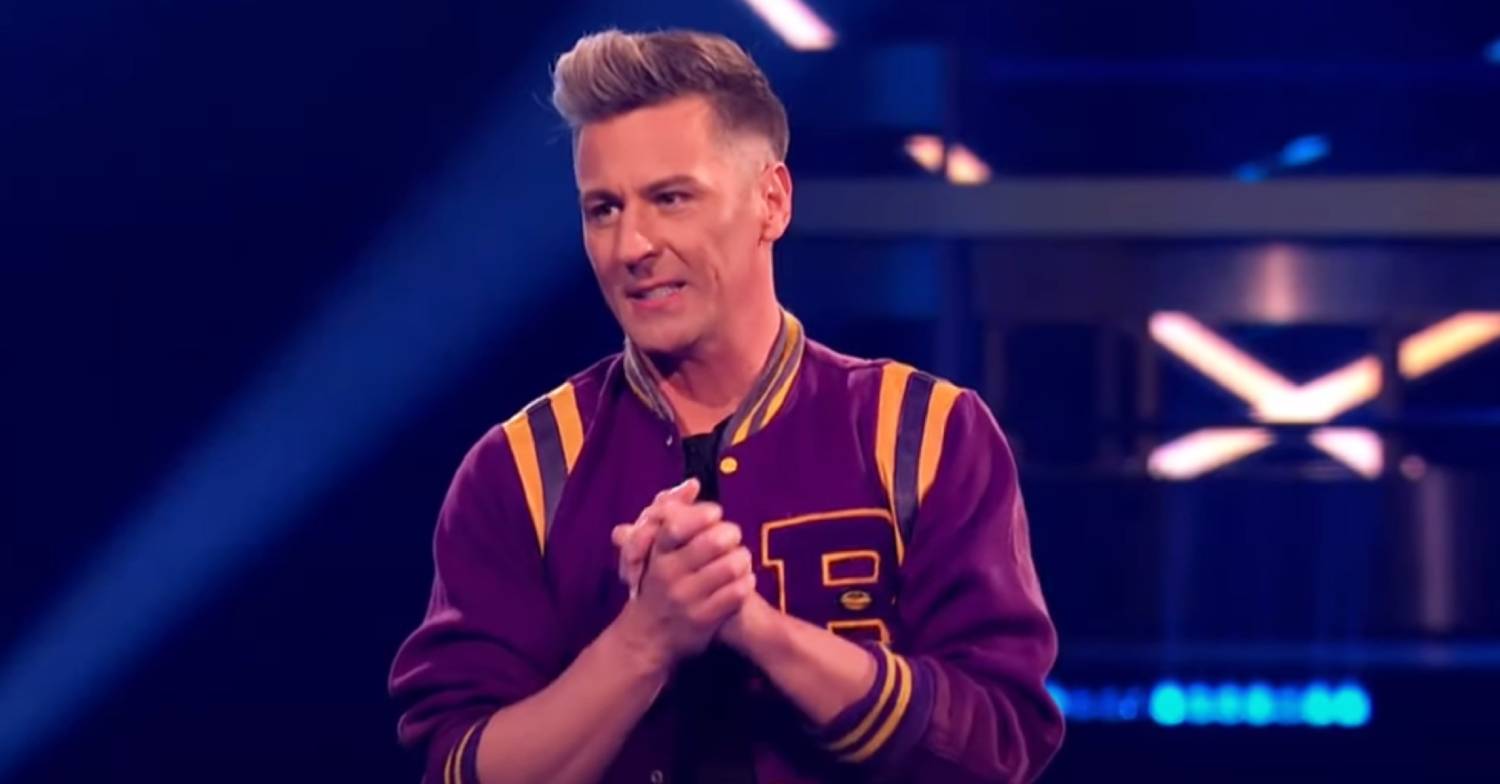 Dancing On Ice star Matt Evers clasps his hands