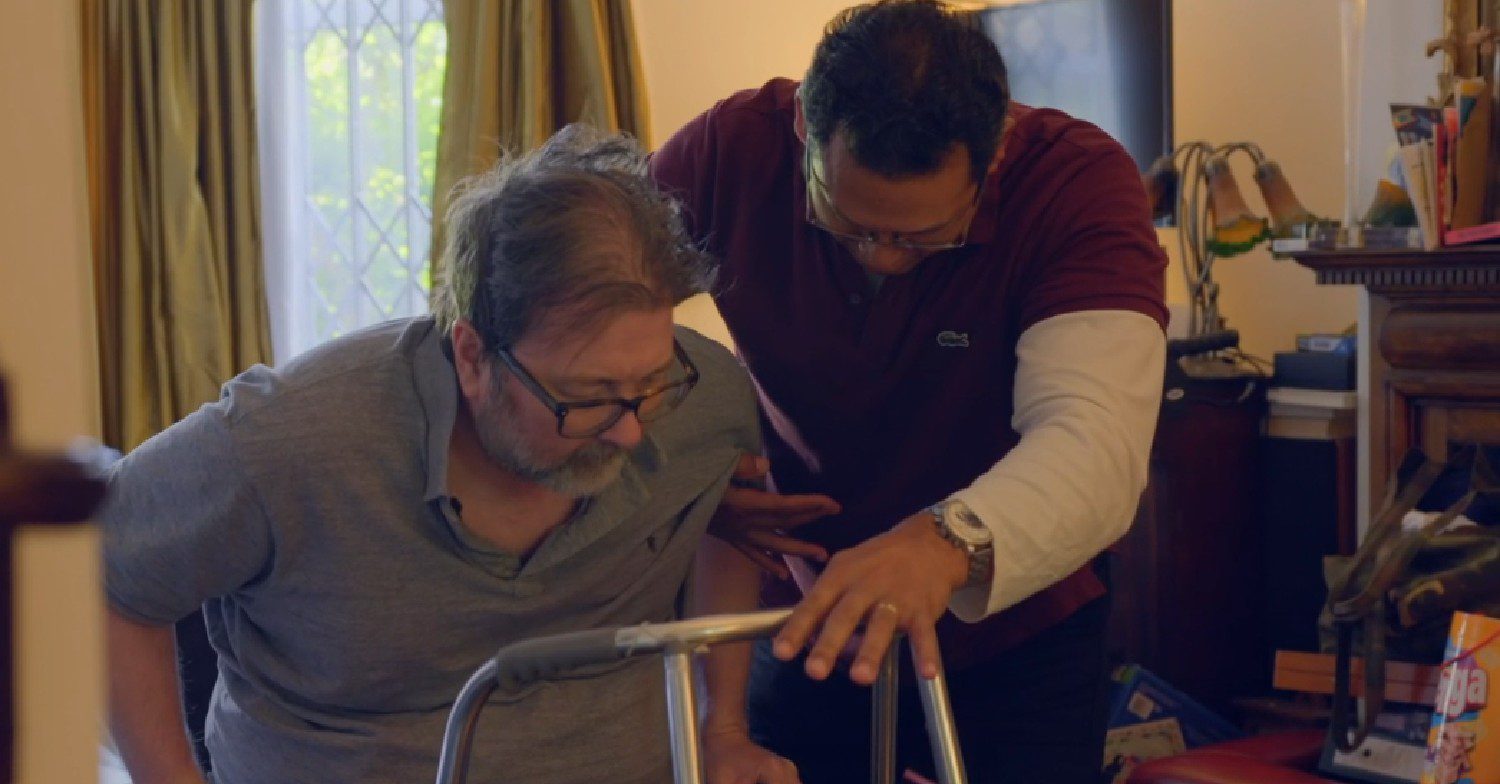 Derek Draper being helped by carer in Kate Garraway documentary