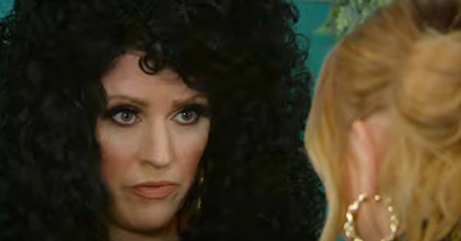 Emmerdale's Kerry is miserable whilst in a black, curly wig