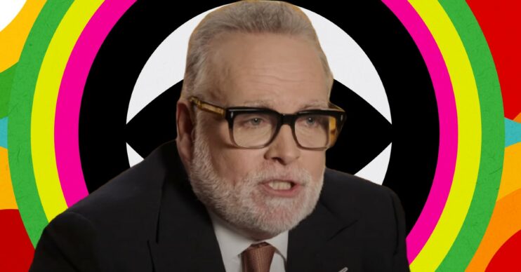 Gary Goldsmith in front of Celebrity Big Brother logo