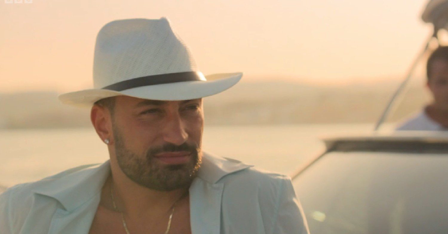 Giovanni Pernice sat on a boat in Anton & Giovanni's Adventures in Spain