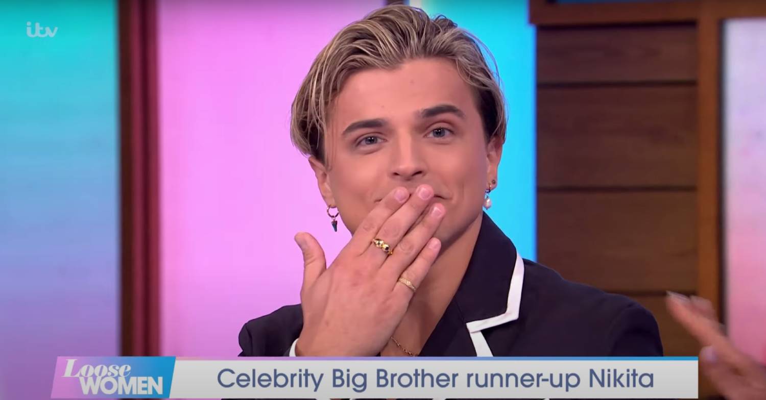 Nikita Kuzmin covers his mouth with his hand on Loose Women today