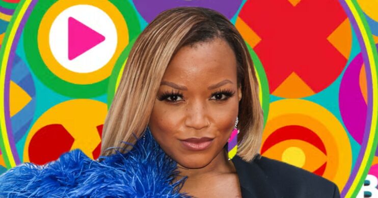 Marisha Wallace pouting in front of Celebrity Big Brother logo
