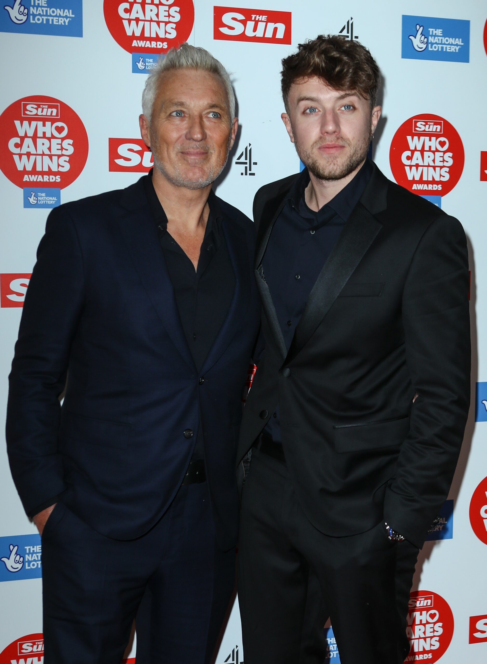 Roman Kemp and dad Martin smiling at The Sun awards