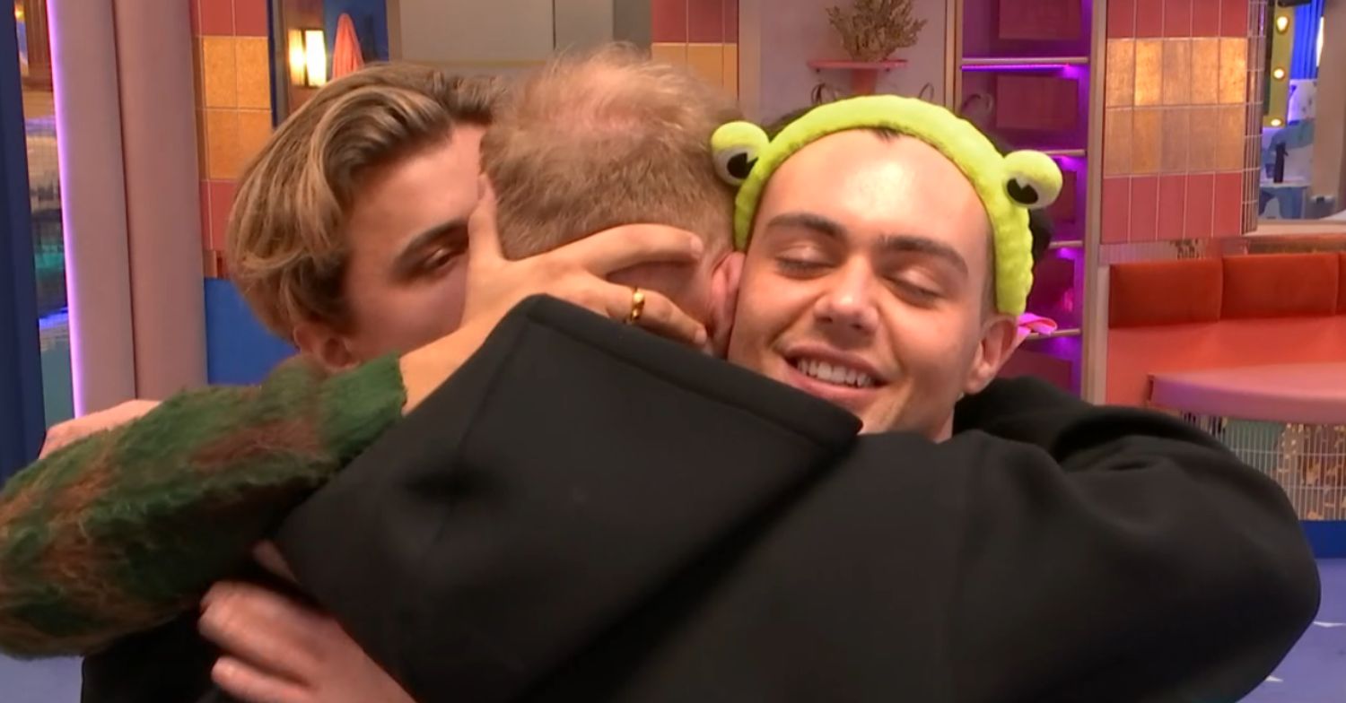 Nikita Kuzmin, Colson Smith, and Bradley Riches in a group hug