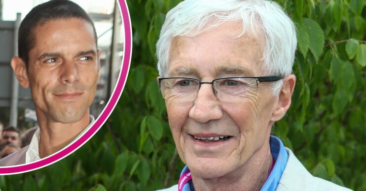 Paul O'Grady smiling at Chelsea Flower Show and husband Andre smiling at event