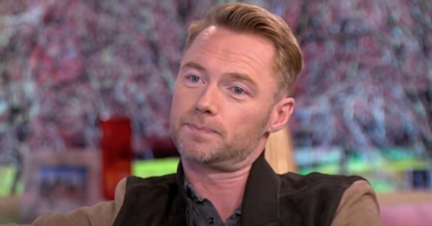 Ronan Keating talking on This Morning pulling a neutral expression