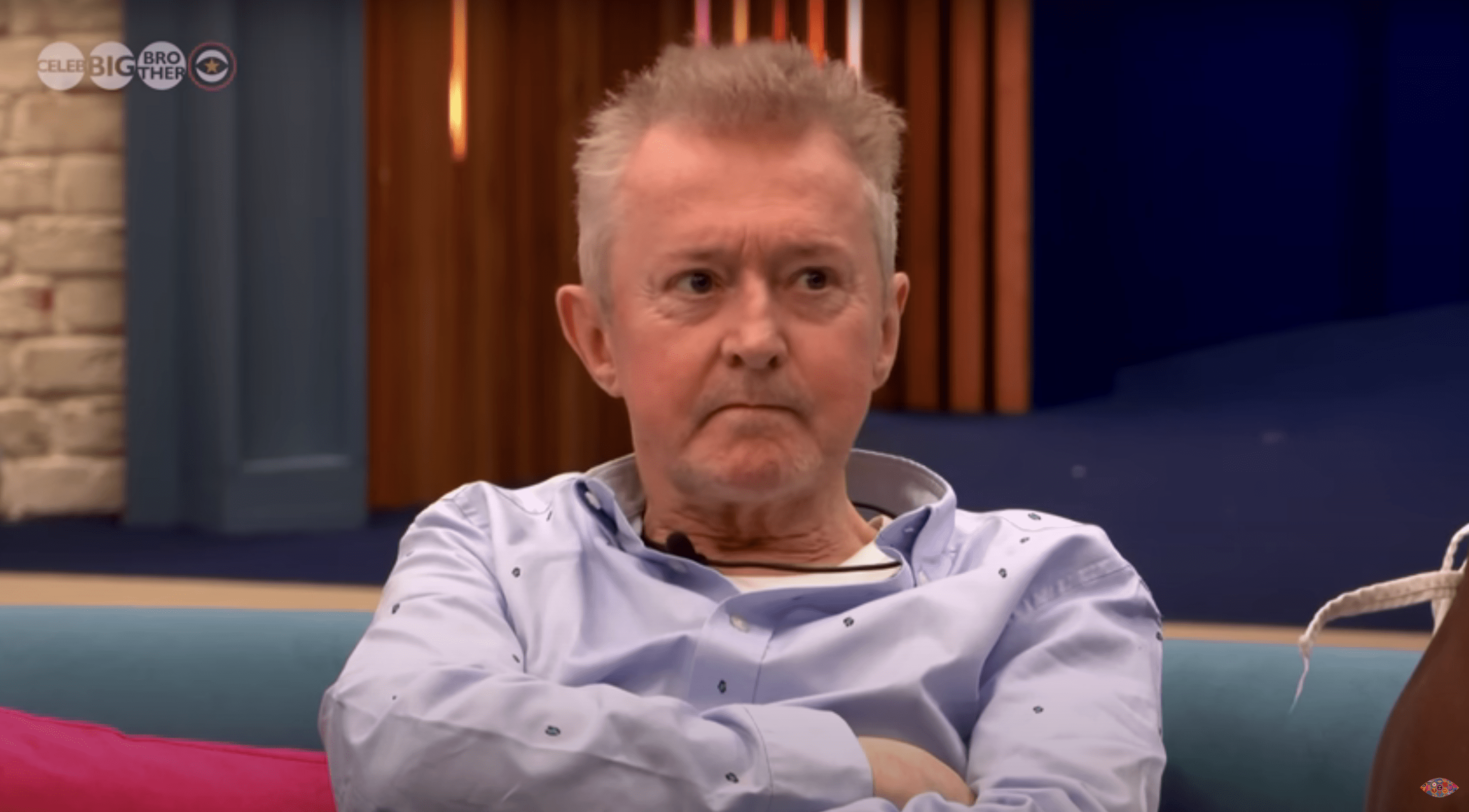 Louis Walsh arms folded looking annoyed on Celebrity Big Brother