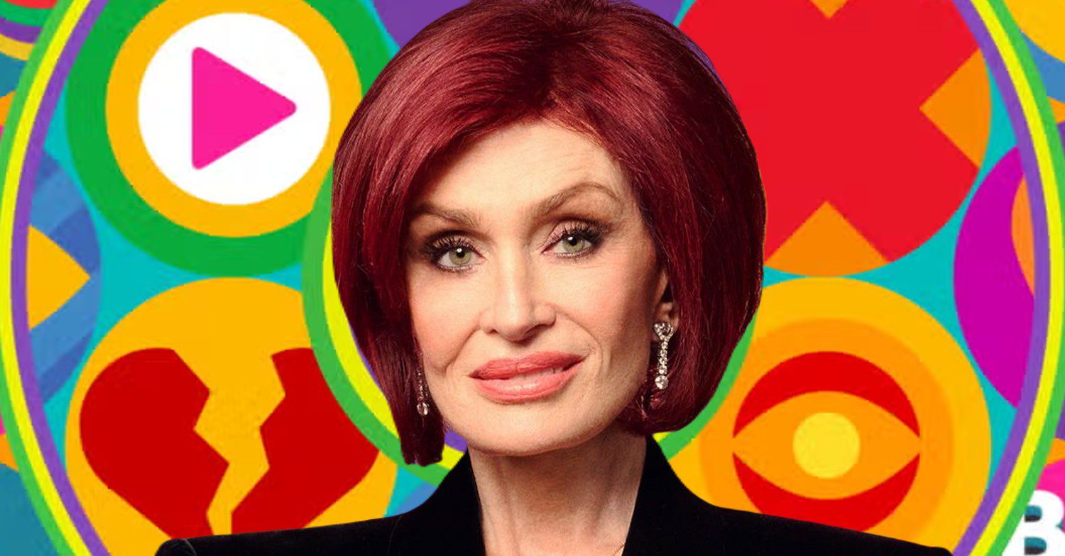 Sharon Osboune smiling in front of Celebrity Big Brother logo