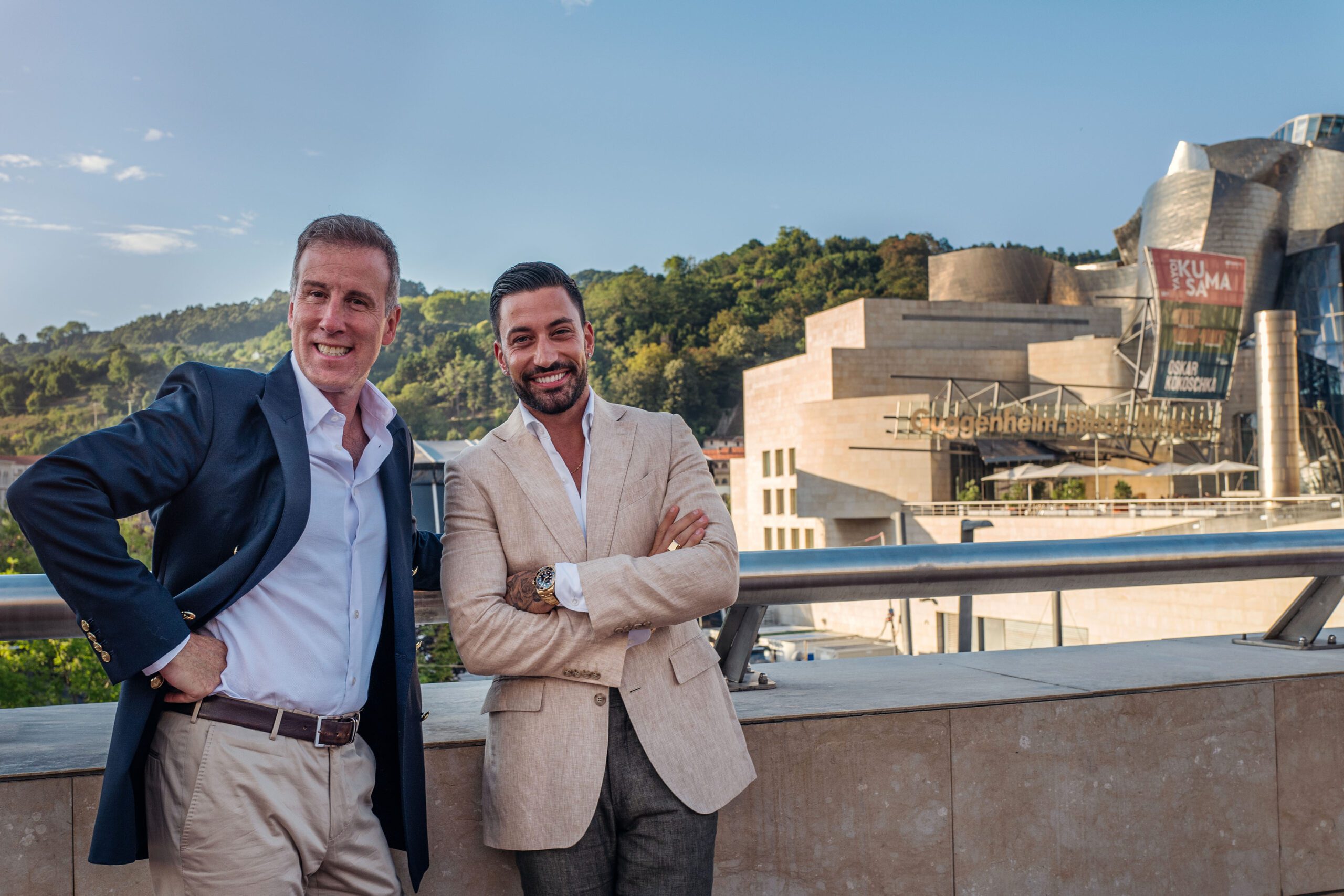 Strictly's Giovanni Pernice and Anton Du Beke stood outside in the sunshine smiling in Spain