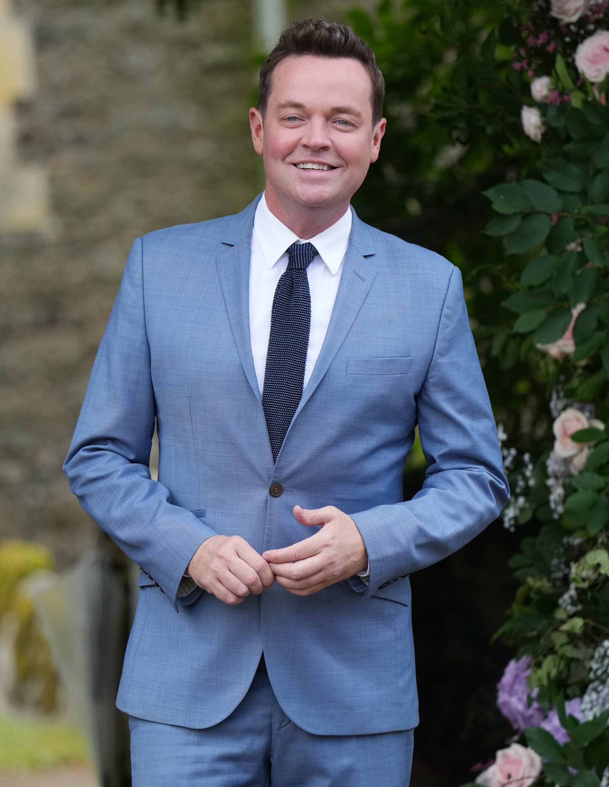 Stephen Mulhern smiling in a suit
