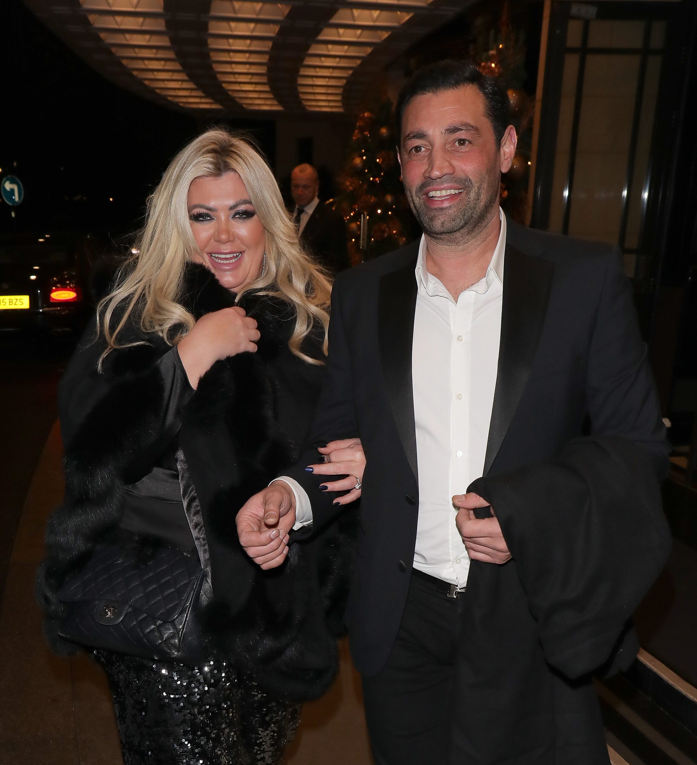 Gemma Collins and Rami Hawash walking and smiling both wearing black