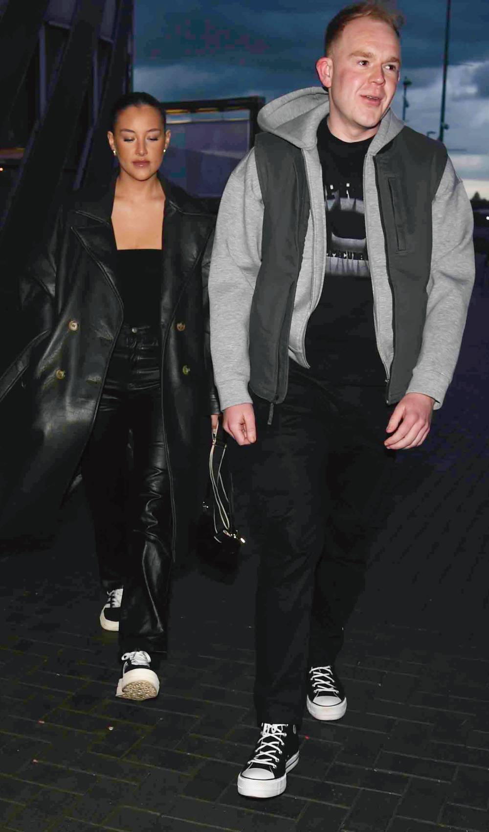 Colson Smith walks with girlfriend Taylor Gunn