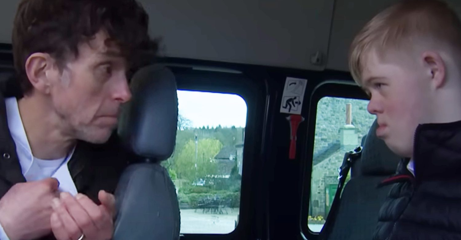 Emmerdale's Marlon and Leo are talking to each other in the bus