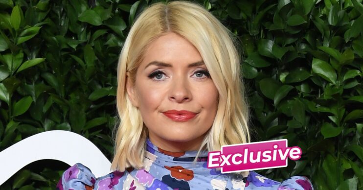 Holly Willoughby posing at event with ED! exclusive banner