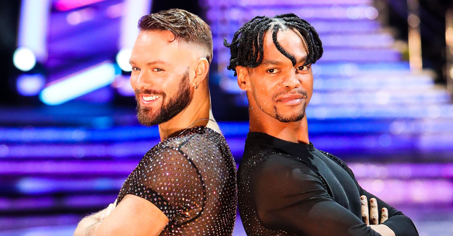 John Whaite and Johannes Radebe posing back to back on Strictly