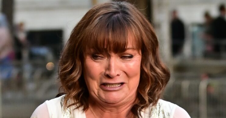 Lorraine Kelly looking upset in the street