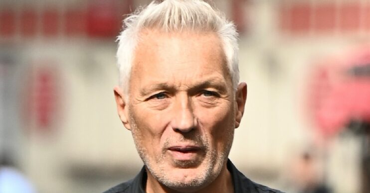 Martin Kemp straight faced walking in London