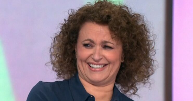 Loose Women star Nadia Sawalha laughing on set of Loose Women wearing blue shirt close-up comp