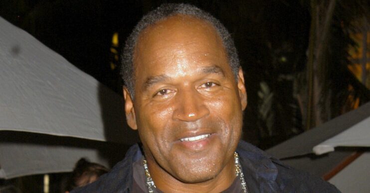 OJ Simpson smiling wearing black