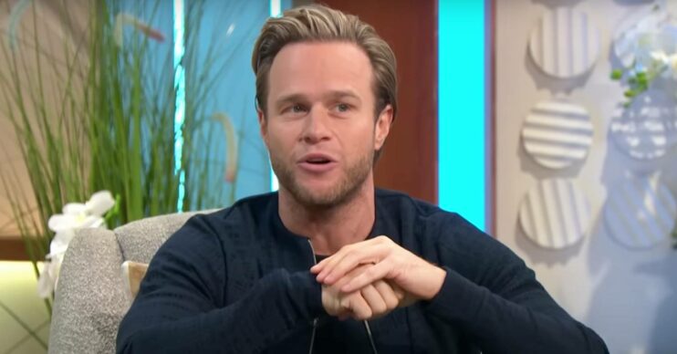 Olly Murs looks to his side
