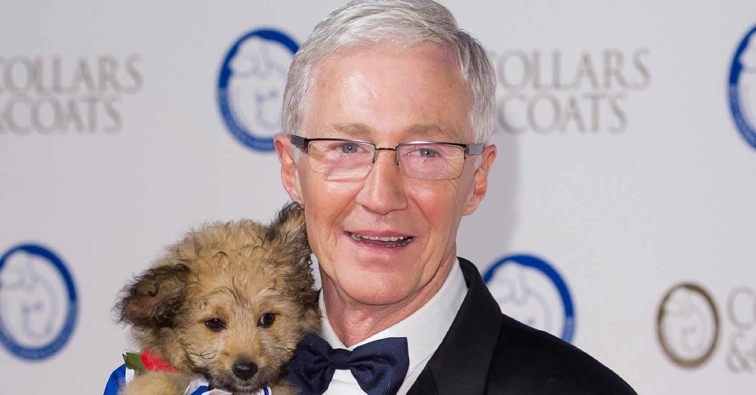 Paul O'Grady holding a dog
