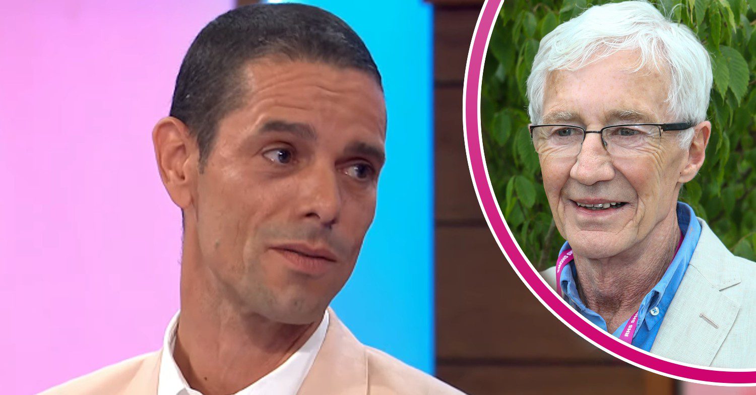 Paul O'Grady smiling and his husband Andre Portasio on Loose Women