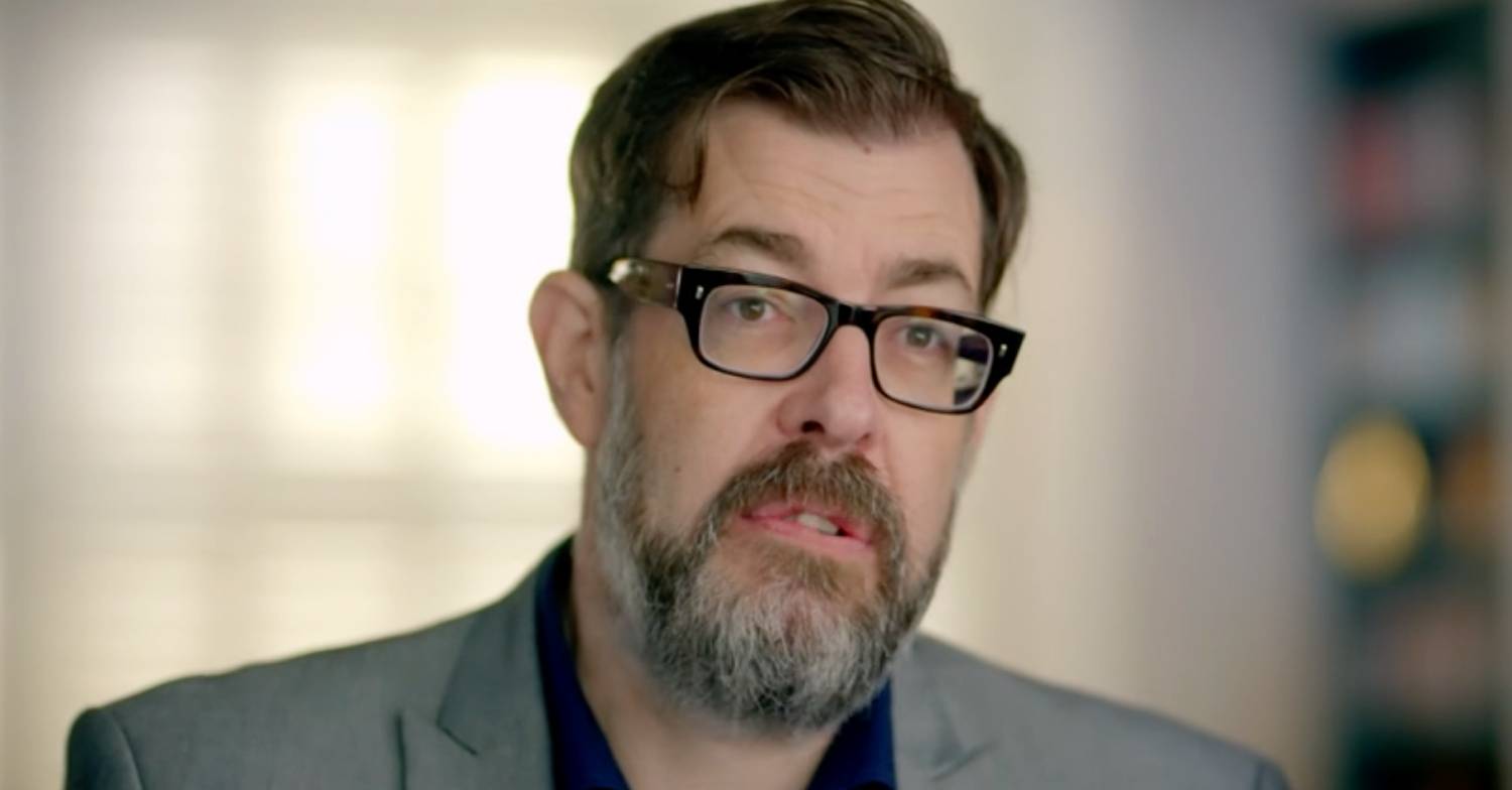Richard Osman speaks to the camera