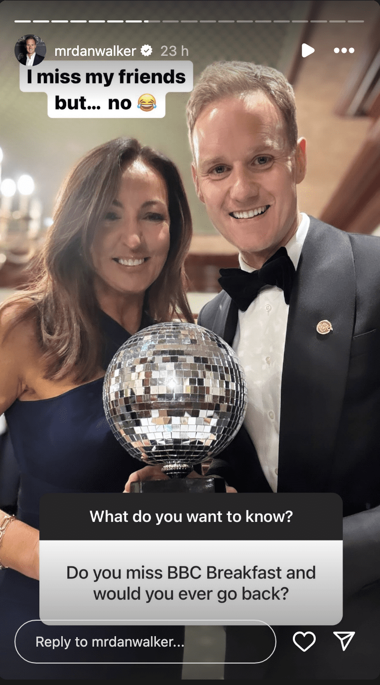 Dan Walker and Sally Nugent holding a trophy 