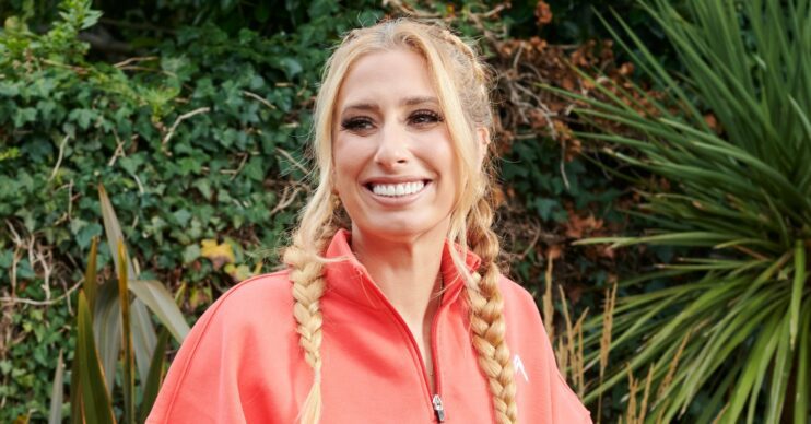 Stacey Solomon on her new show renovation rescue in garden wearing orange fleece