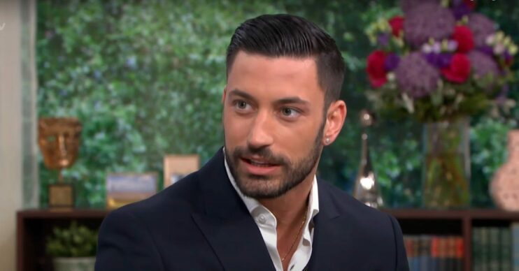 Giovanni Pernice chatting on This Morning wearing black suit