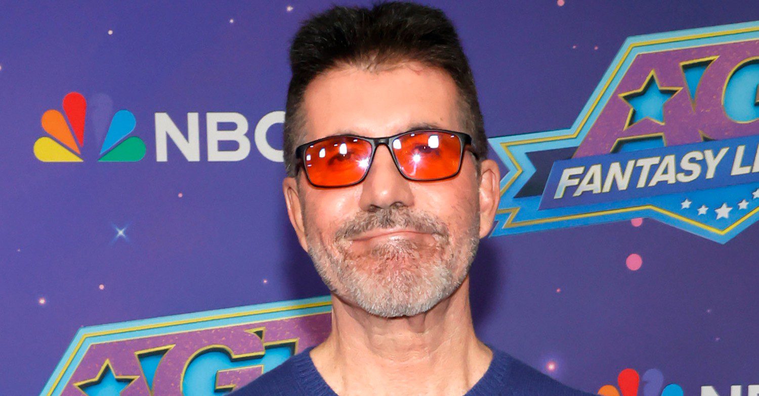 Simon Cowell wearing red sunglasses