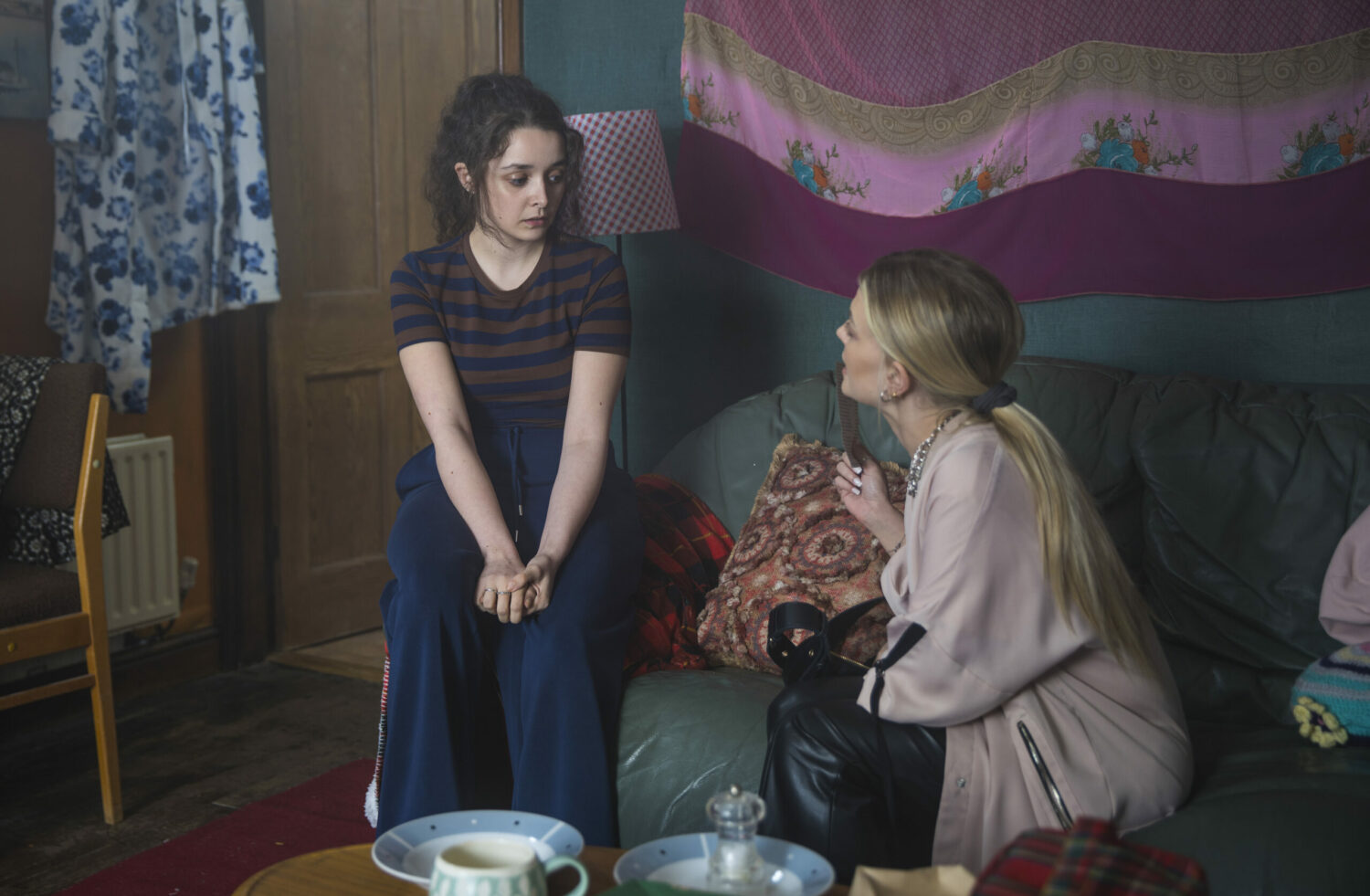 Ella looks scared as Bethany shows her a photo in Coronation Street