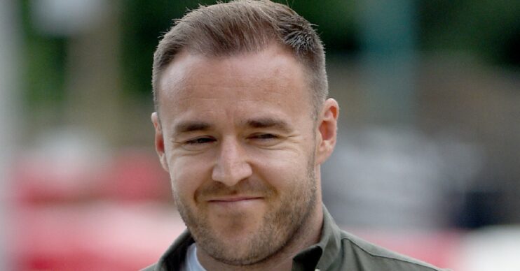 Alan Halsall in a khaki green top