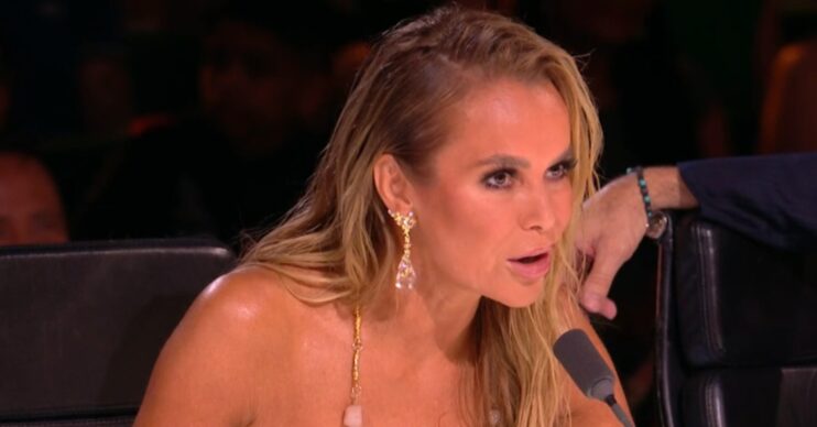 Amanda Holden talking and wearing gold dress on Britain's Got Talent