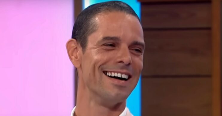 Paul O'Grady's husband on Loose Women with big smile in beige suit