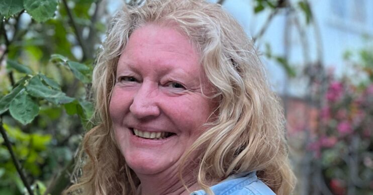 Charlie Dimmock smiling in a garden