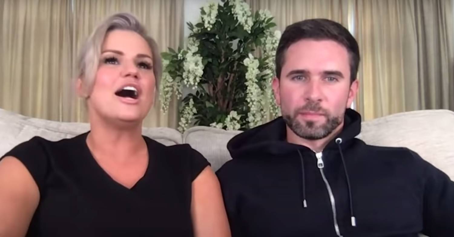 Kerry Katona speaks while Ryan Mahoney looks forward