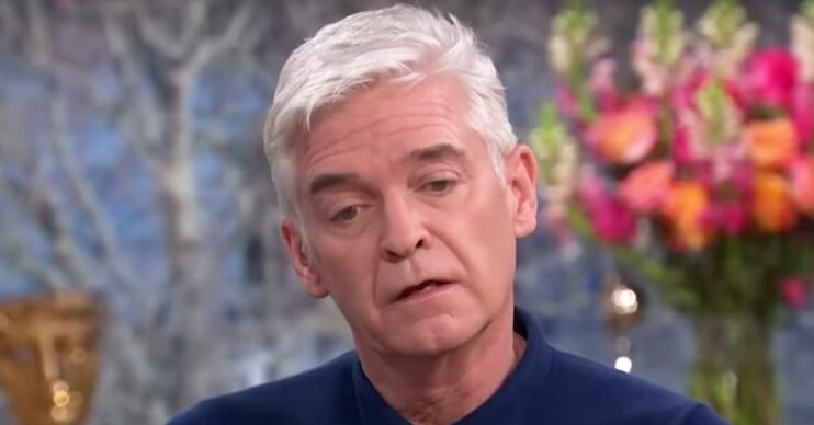 Phillip Schofield looks downwards