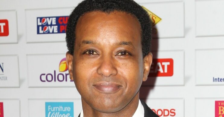 Rageh Omaar in a suit and bow tie smiling