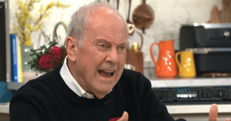 Gyles Brandreth looking angry on This Morning in black jumper