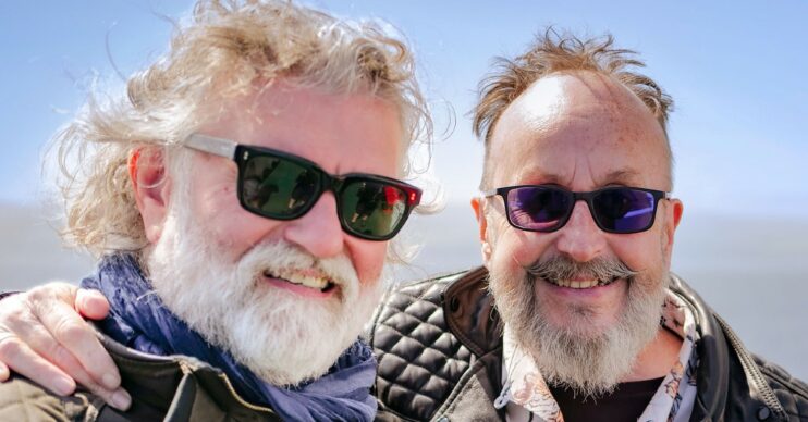 The Hairy Bikers Si King and Dave Myers smiling at the camera wearing sunglasses